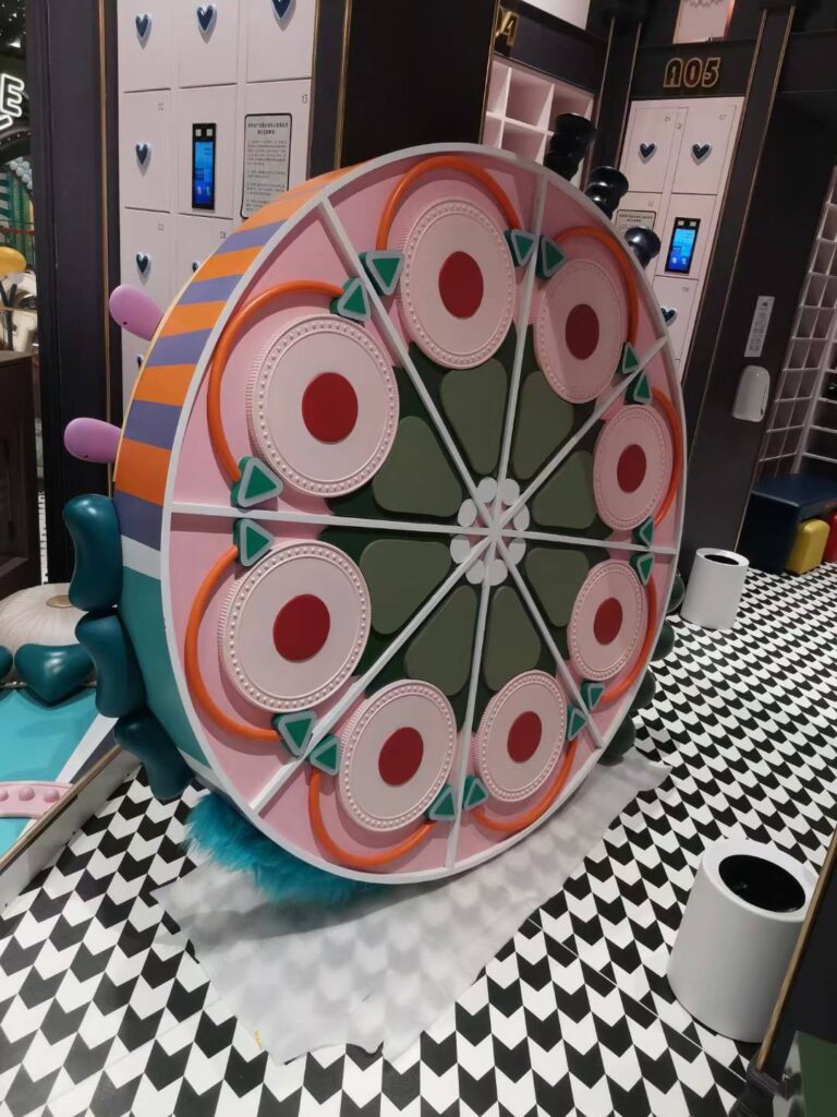 Large scale 3D printed interactive carnival wheel for indoor playground